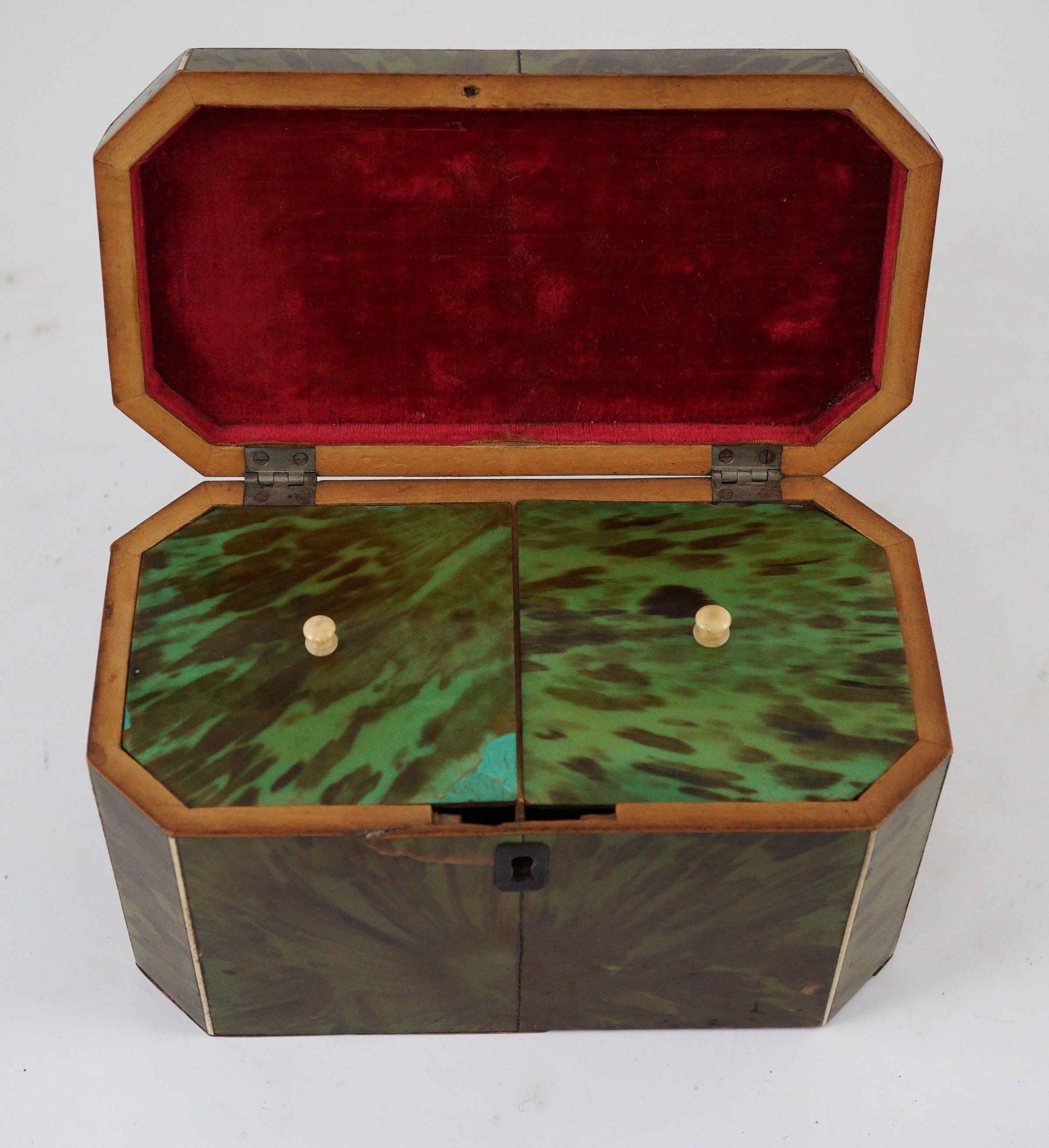 A George III green stained tortoiseshell and ivory octagonal tea caddy, 18.5cm wide 9.5cm deep 11cm high